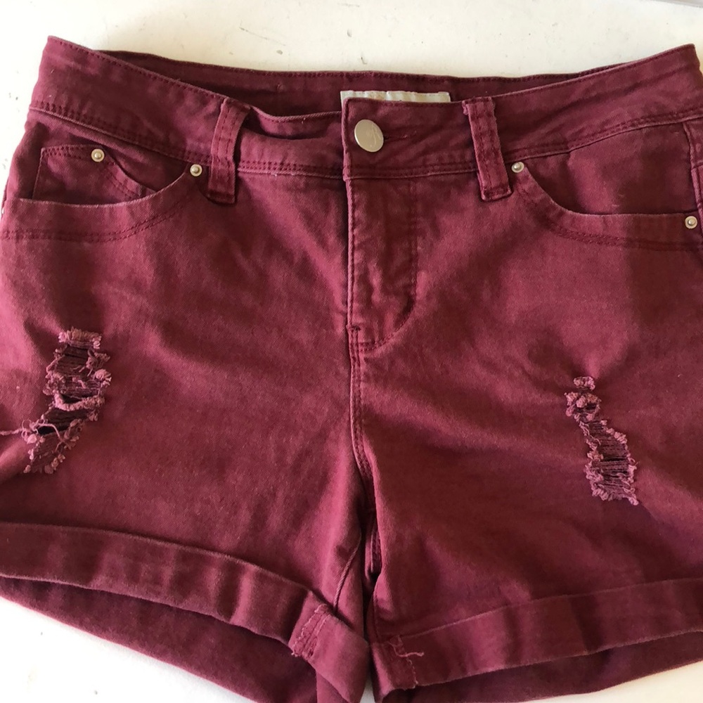 Royalty for me, maroon shorts.